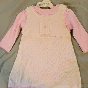 Signature Little Me Ivory knit dress over long sleeved pink onesie with socks